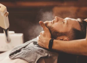 Man relaxing during professional facial services for men’s skin and wellness care in Brevard County holistic med spa
