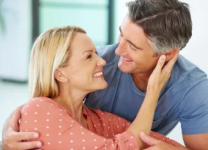 Confident man enjoying intimate moment with partner after personalized men’s wellness therapy in Brevard County