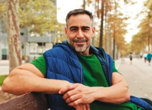 Confident man relaxing with healthy skin and hair after advanced men’s wellness treatments in Brevard County