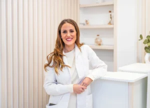 Smiling trichologist at Holistic Med Spa Brevard County offering expert scalp and hair wellness care